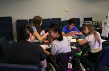 Students and instructors working together backstage at JDS Creative Academy