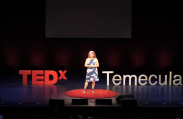Diane Strand speaking at a creative arts event, empowering students and entrepreneurs through JDS Creative Academy and DigiFest® Temecula in California.