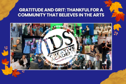 Students and instructors at JDS Creative Academy smiling together during a fall arts class.