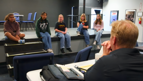 Frozen Jr. Sneak Peek: How We Bring Arendelle to Life on Stage Students performing Frozen Jr. on stage with Arendelle castle backdrop and sparkling snow effects