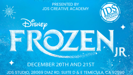 Frozen Jr. cast performing on stage at the JDS Creative Academy Winter Showcase with students in colorful costumes expressing emotion and teamwork